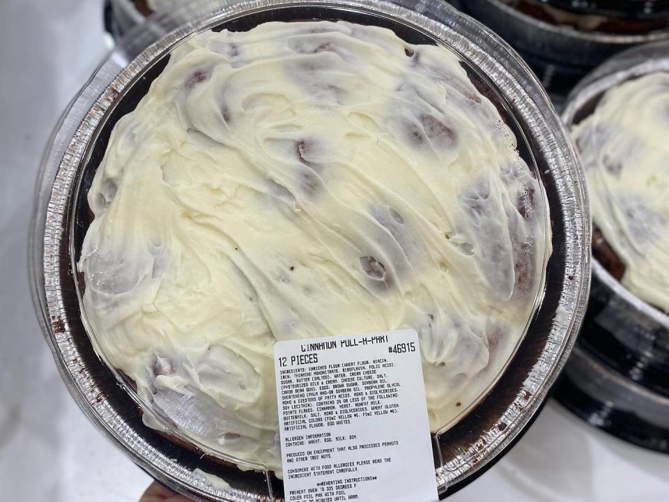 costco pull apart cinnamon rolls with white frosting in clear and silver packaging