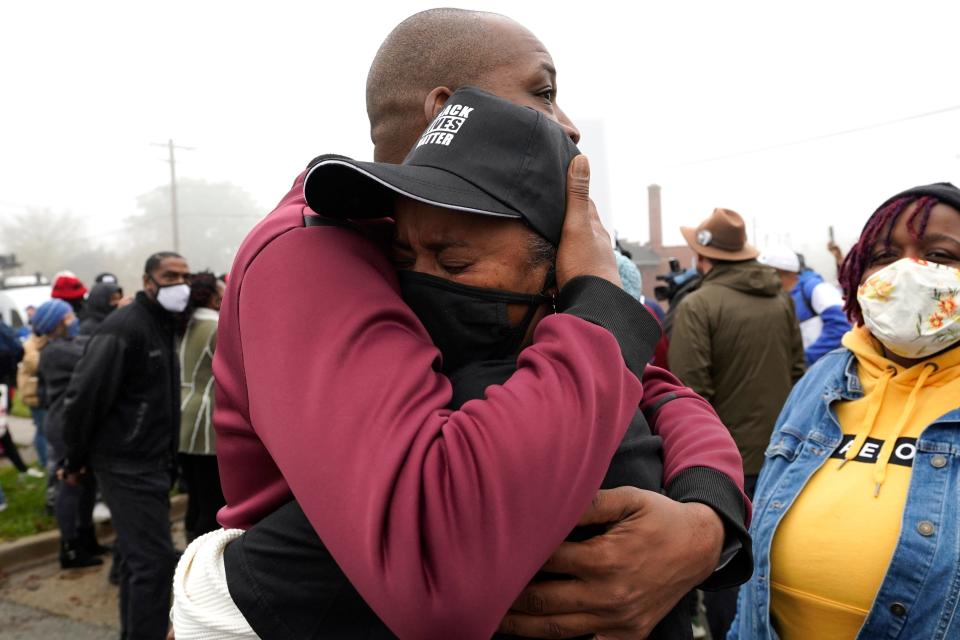 Marcellis Stinnette's grandmother Sherrellis Stinnette, right, cries as she hugs Rayon Edwards during protest rally for Marcellis Stinnette who killed by Waukegan Police Tuesday in Waukegan, Ill., Thursday, Oct. 22, 2020.