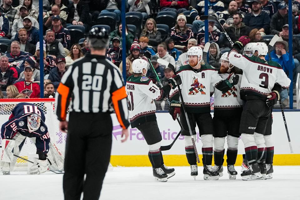 Nov 16, 2023; Columbus, Ohio, USA; Teammates celebrate a goal by Arizona Coyotes left wing Lawson Crouse (67) during the third period of the NHL hockey game against the Columbus Blue Jackets at Nationwide Arena. The Blue Jackets lost 3-2.