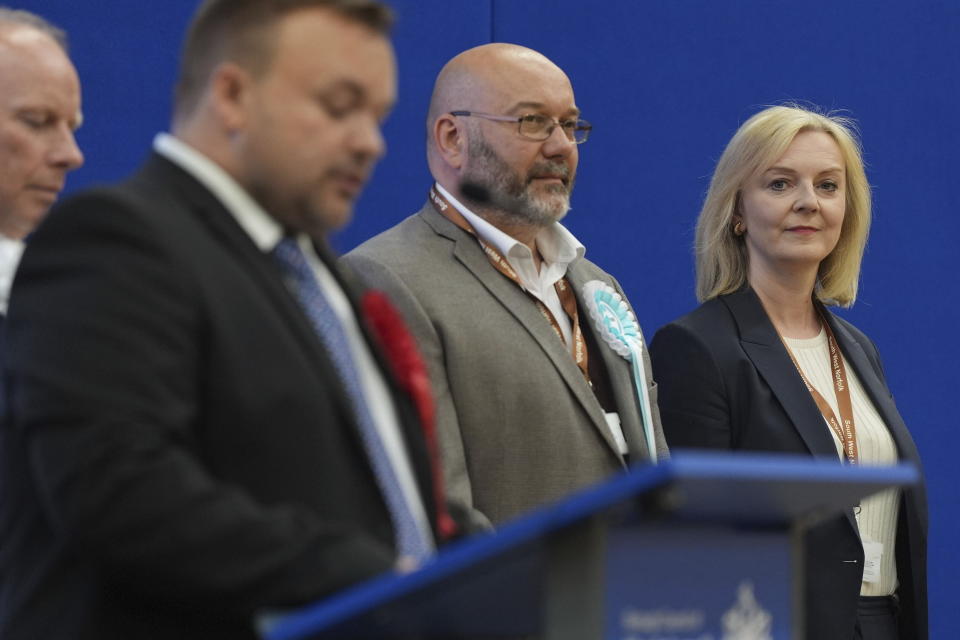 Former prime minister Liz Truss looks across during the declaration as she loses her Norfolk South West seat to Labour at Alive Lynnsport in King's Lynn, Norfolk, during the count in the 2024 General Election, Friday July 5, 2024. Britain’s Labour Party swept to power Friday after more than a decade in opposition, as a jaded electorate handed the party a landslide victory — but also a mammoth task of reinvigorating a stagnant economy and dispirited nation. (Jacob King/PA via AP)