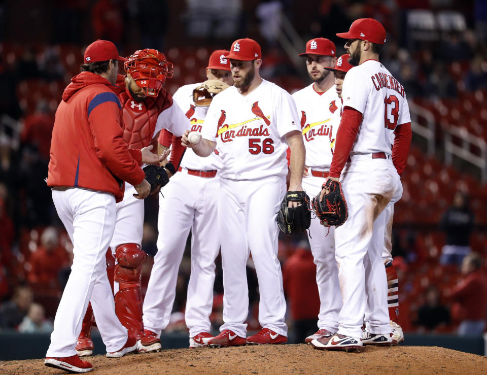 Cardinals reliever Greg Holland is removed by manager Mike Matheny during the 10th inning of Monday’s game against the Brewers. (AP Photo)
