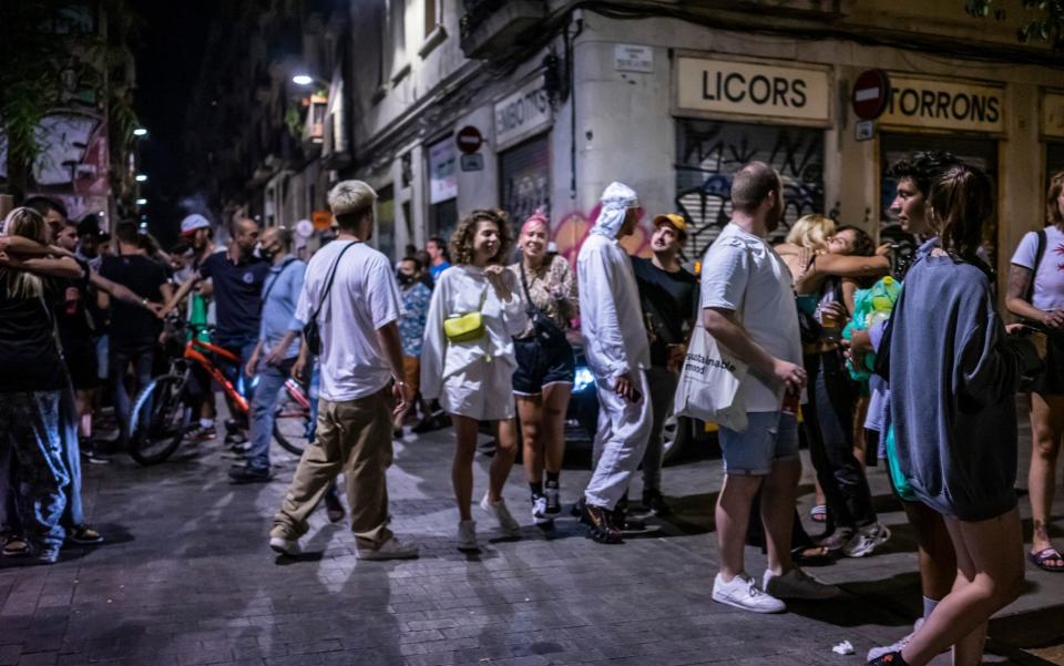 A group of young people gather in Joaquim Costa street in Barcelona after curfew hours, introduced by courts to stem a rise in Covid-19 infections, on 17 July 2021 - Jose Colon/Getty Images
