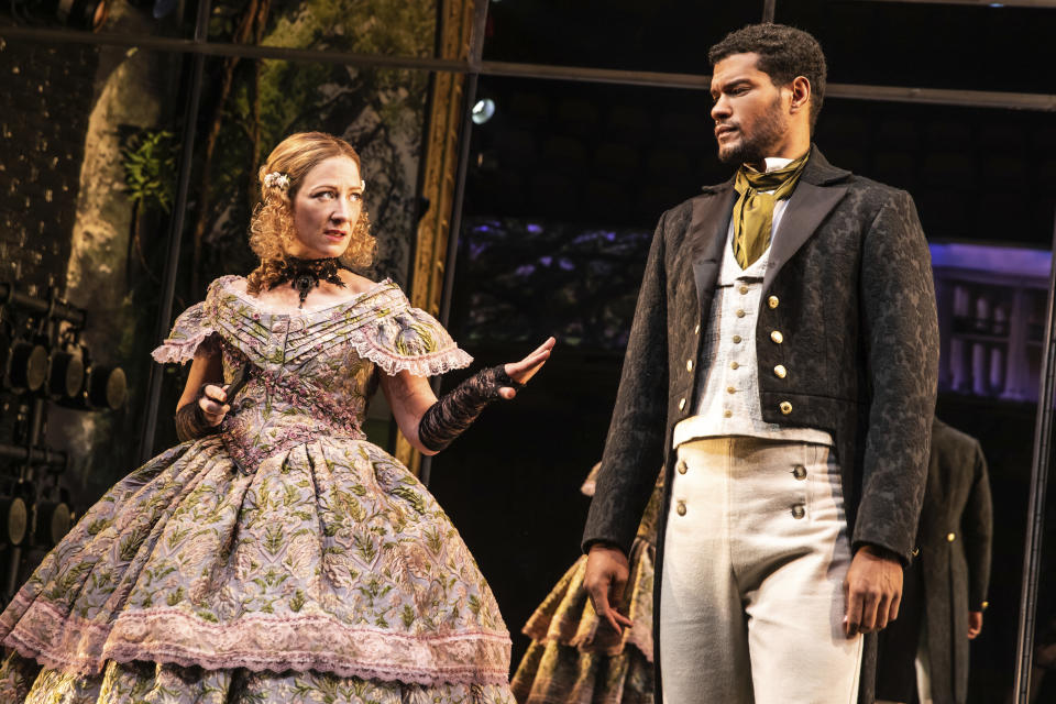 Annie McNamara, left, and Sullivan Jones wear costumes designed by Dede Ayite during a performance of "Slave Play" in New York. Ayite has earned two 2021 Tony Award nominations for costume design, one for "Slave Play" and another for “A Soldier's Story.” (Matthew Murphy/DKC O&M Co. via AP)