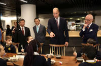 Britain's Prince William joins local school children from St Cuthbert with St Matthias CE Primary School at a copper beating workshop during the official opening of Japan House in London, Britain, September 13, 2018. Tim P. Whitby/Pool via REUTERS