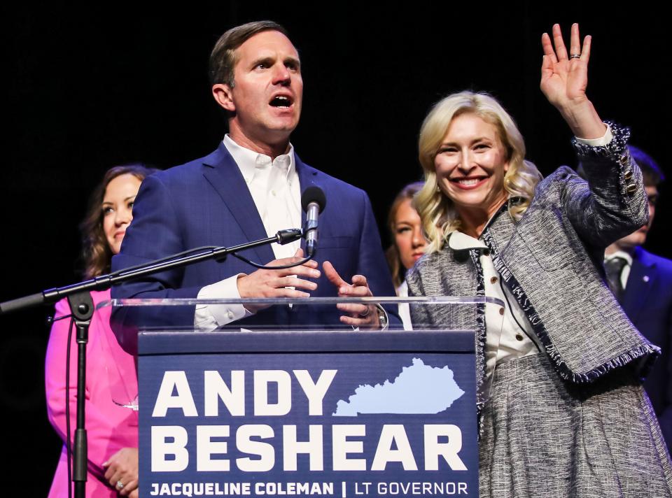 As Gov. Andy Beshear gives his victory speech, his wife Britainy Beshear waves to the crowd Tuesday, Nov.7, 2023 at the post election party in Louisville, Ky.