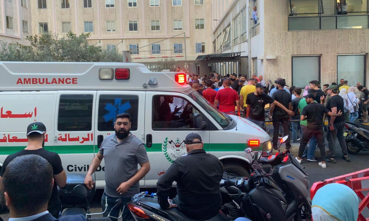 <span>People gather outside the American University hospital in Beirut on Tuesday.</span><span>Photograph: Bassam Masri/AP</span>