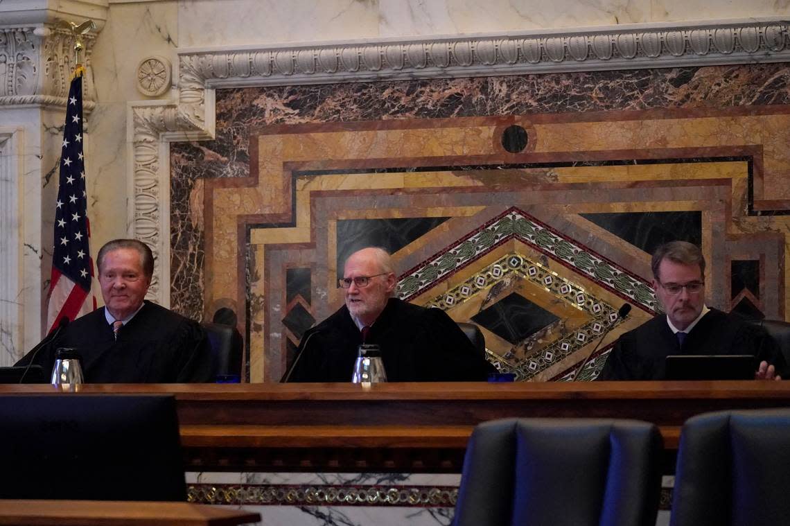 Judges Milan D. Smith Jr., from left, sits on a panel with Sidney R. Thomas and Michael J. McShane before hearing arguments at the Ninth Circuit Court of Appeals in San Francisco, Monday, Nov. 14, 2022. Apple is heading into a courtroom faceoff against Epic Games, the company behind the popular Fortnite video game, reviving a high-stakes antitrust battle over whether the digital fortress shielding the iPhone’s app store illegally enriches the world’s most valuable company while stifling competition.