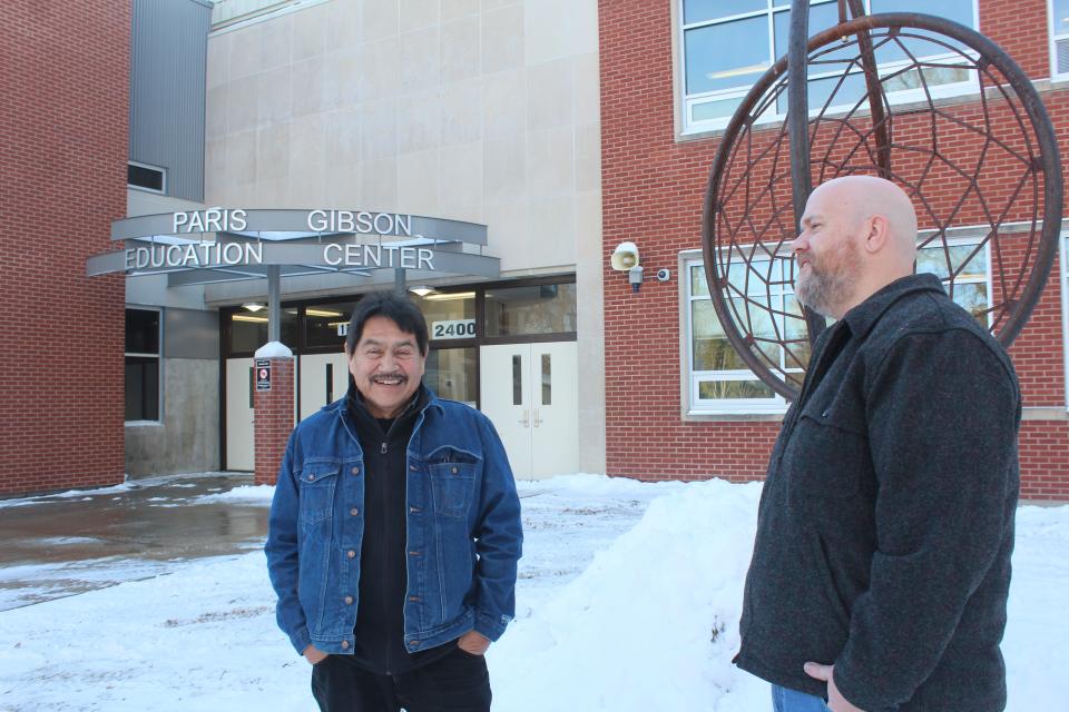 Ryan Hart (right), Student Services Coordinator Ryan Hart (right) talks with homeless liaison Lee Houle outside the Paris Gibson Center