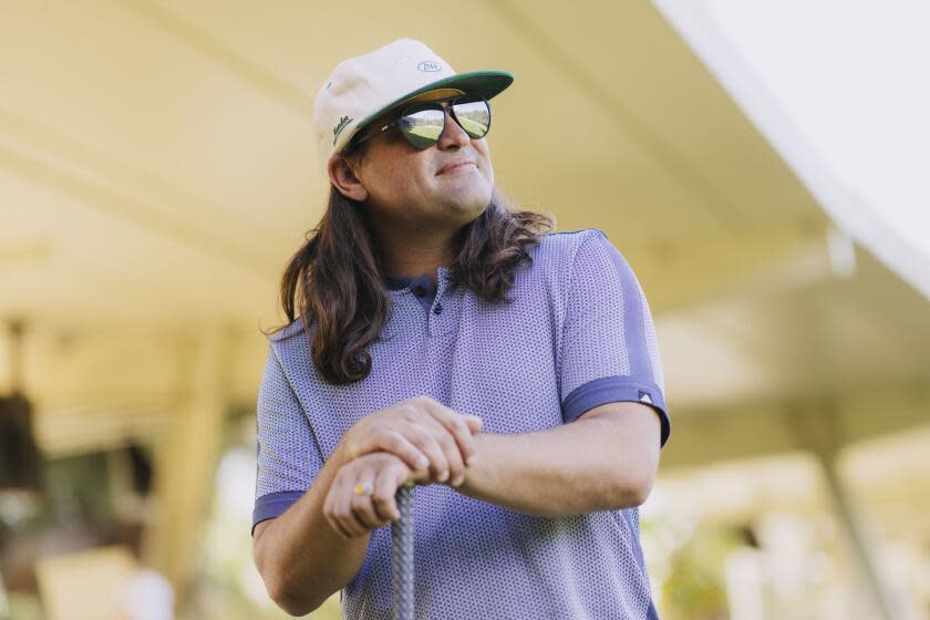 Los Angeles, CA - March 15: Dave Fink, a golf influencer, stands at the Wilson Harding Driving Range on Friday, March 15, 2024 in Los Angeles, CA. He is a prominent voice in bringing attention to the controversy of brokers and bots booking tee times at public golf courses. (Carlin Stiehl / For The Times)