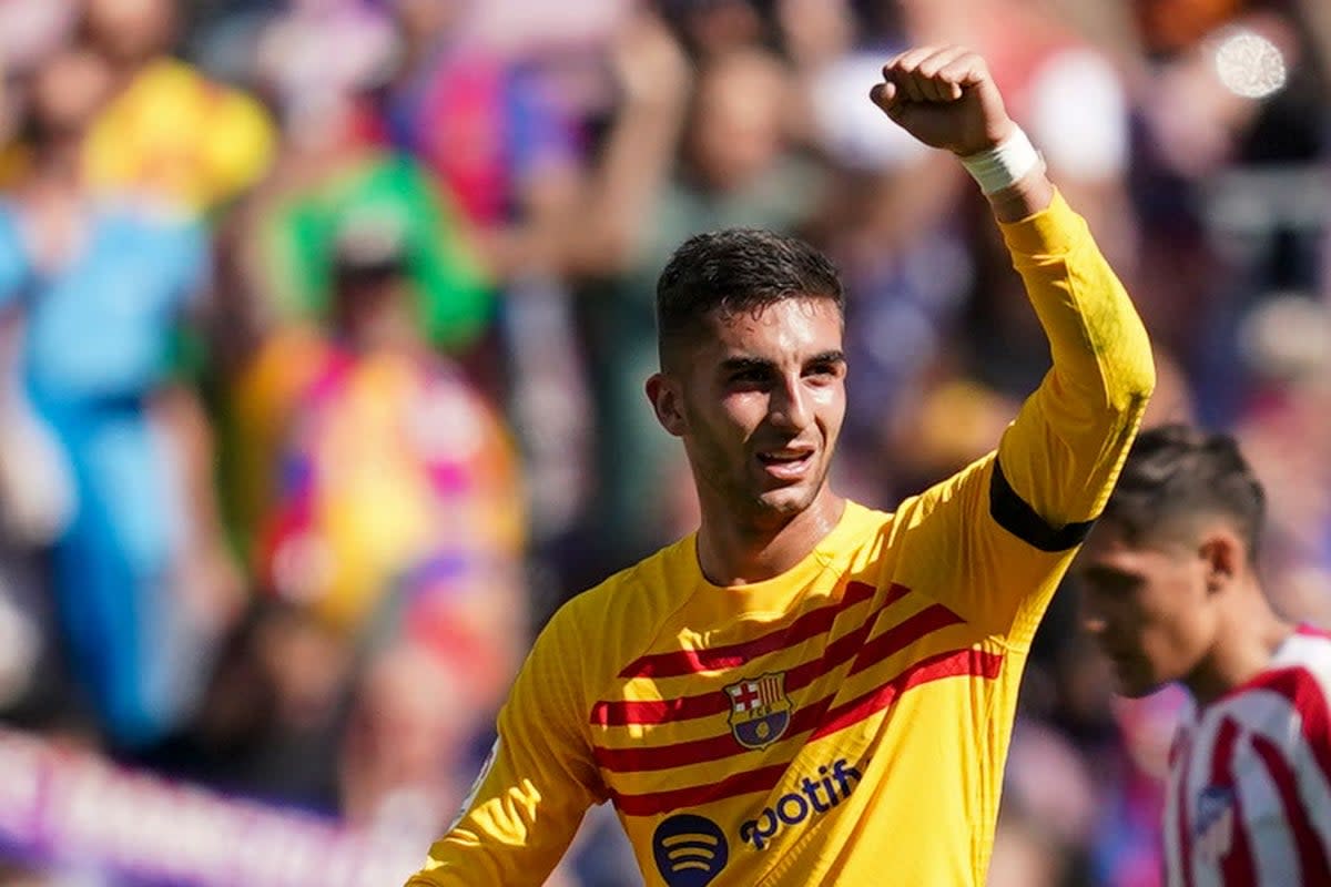 Barcelona’s Ferran Torres celebrates after scoring against Atletico Madrid (Joan Mateu/AP) (AP)