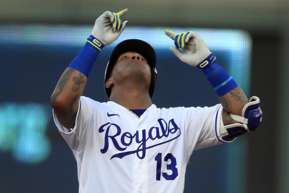 Kansas City Royals Salvador Perez gestures while celebrating his RBI double during the third inning of a baseball game against the Chicago Cubs at Kauffman Stadium in Kansas City, Mo., Thursday, Aug. 6, 2020. (AP Photo/Orlin Wagner)