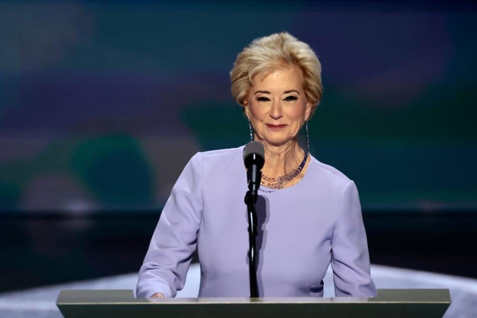 Linda McMahon, former administrator of the US Small Business Administration, during the Republican National Convention. She wears a light purple outfit and is behind the podium and mic.