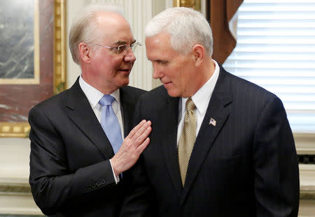 FILE PHOTO: U.S. Secretary of Health and Human Services (HHS) Tom Price (L) and Vice President Mike Pence (R) arrive to meet with representatives of conservative political groups to discuss their plans for repealing and replacing ObamaCare in the Eisenhower Executive Office Building at the White House in Washington, U.S. March 10, 2017. REUTERS/Jonathan Ernst/File Photo