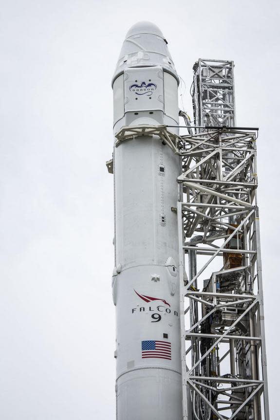 An unmanned SpaceX Dragon cargo capsule sits atop its Falcon 9 rocket at the private spaceflight company's launch pad at Cape Canaveral Air Force Station in Florida on Sept. 19, 2014. Bad weather prevented a planned early-morning launch toward