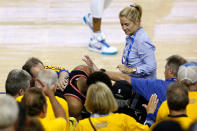 Kyle Lowry #7 of the Toronto Raptors is pushed by Warriors minority investor Mark Stevens (blue shirt) after falling into the seats after a play against the Golden State Warriors in the second half during Game 3 of the 2019 NBA Finals on June 5, 2019 in Oakland, California. (Photo by Lachlan Cunningham/Getty Images)