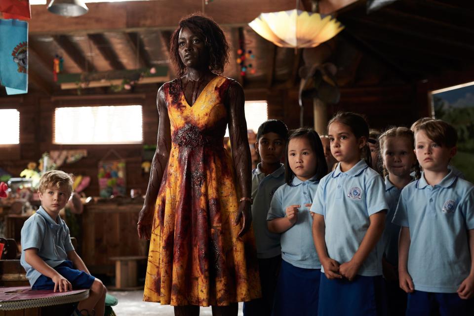 Kindergarten teacher Miss Caroline (Lupita Nyong'o) protects her students from a zombie apocalypse in horror comedy "Little Monsters."
