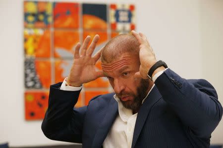 WWE Executive Vice President of Talent, Live Events & Creative Paul "Triple H" Levesque talks during an interview before a taping of the WWE's NXT show at Full Sail University in Winter Park, Florida, November 30, 2016. REUTERS/Scott Audette