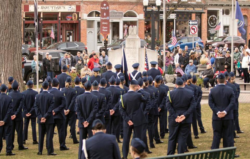 Veterans, family and supporters as well as Howell High School's Junior ROTC attend a Veterans Day ceremony in front of the historic Livingston County Courthouse Friday, Nov. 11, 2022.