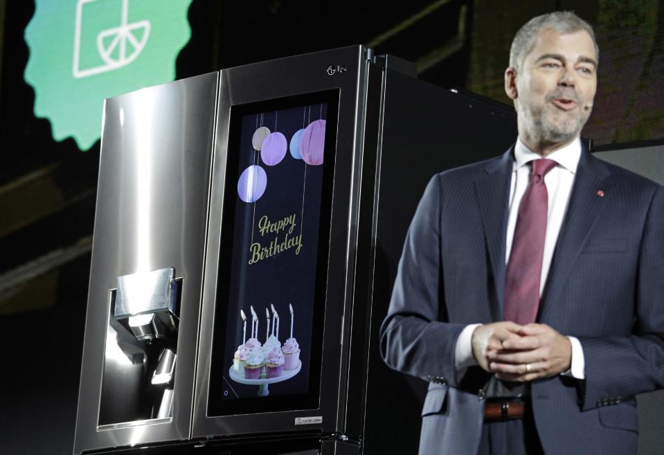 David VanderWaal, vice president of marketing for LG Electronics USA, unveils the LG InstaView Door-in-Door refrigerator during an LG news conference before CES International, Wednesday, Jan. 4, 2017, in Las Vegas. (AP Photo/John Locher)