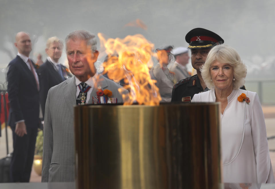 FILE - Britain's Prince Charles and his wife Camilla, Duchess of Cornwall, visit the India Gate war memorial in New Delhi, India, Nov. 9, 2017. India, once the largest of Britain’s colonies that endured two centuries of imperial rule has moved on. Queen Elizabeth II’s death provoked sympathies from some while for a few others, it jogged memories of a bloody history under the British crown. Among most regular Indians, the news was met with an indifferent shrug. (AP Photo/Manish Swarup, File)