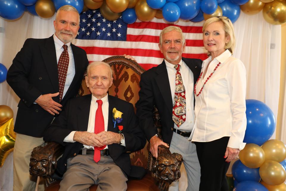 Herbert St. Romain Jr. (seated), celebrated his100th birthday with more than 60 family and friends Sunday at Hotel Bentley. With him are sons Edmund St. Romain and Paul St. Romain and daughter Debbie Head.