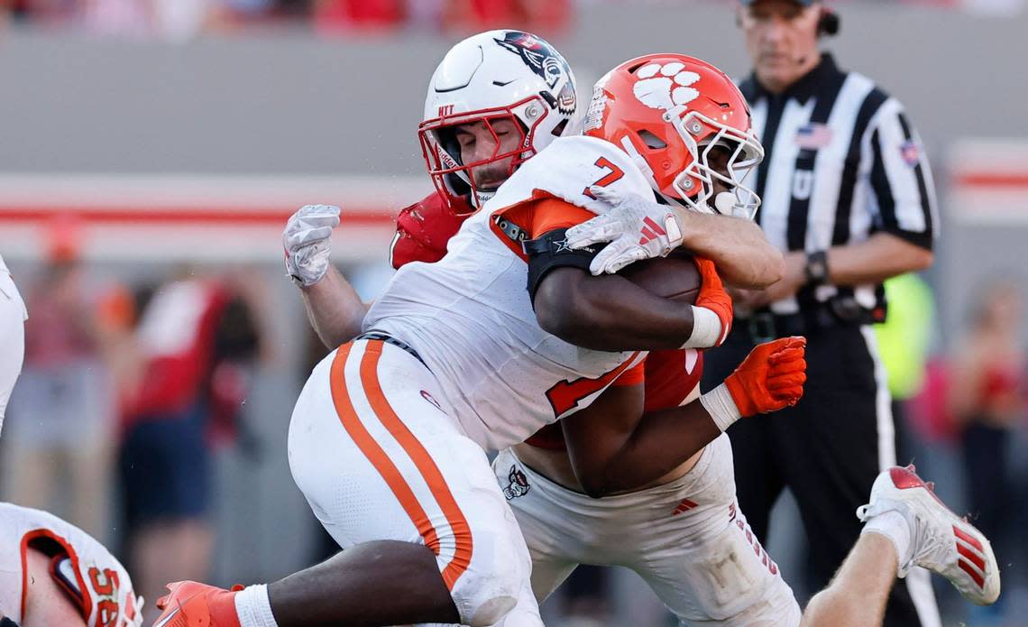 N.C. State linebacker Payton Wilson (11) tackles Clemson running back Phil Mafah (7) during the second half of N.C. State’s 24-17 victory over Clemson at Carter-Finley Stadium in Raleigh, N.C., Saturday, Oct. 28, 2023. Ethan Hyman/ehyman@newsobserver.com