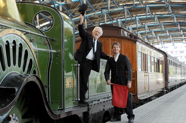 Cribbins on board a train