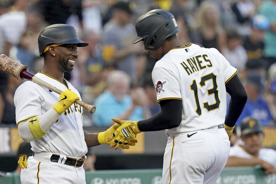 Pittsburgh Pirates' Ke'Bryan Hayes celebrates with Andrew McCutchen after hitting a home run against the Chicago Cubs during the first inning of a baseball game in Pittsburgh, Saturday, Aug. 26, 2023. (AP Photo/Matt Freed)
