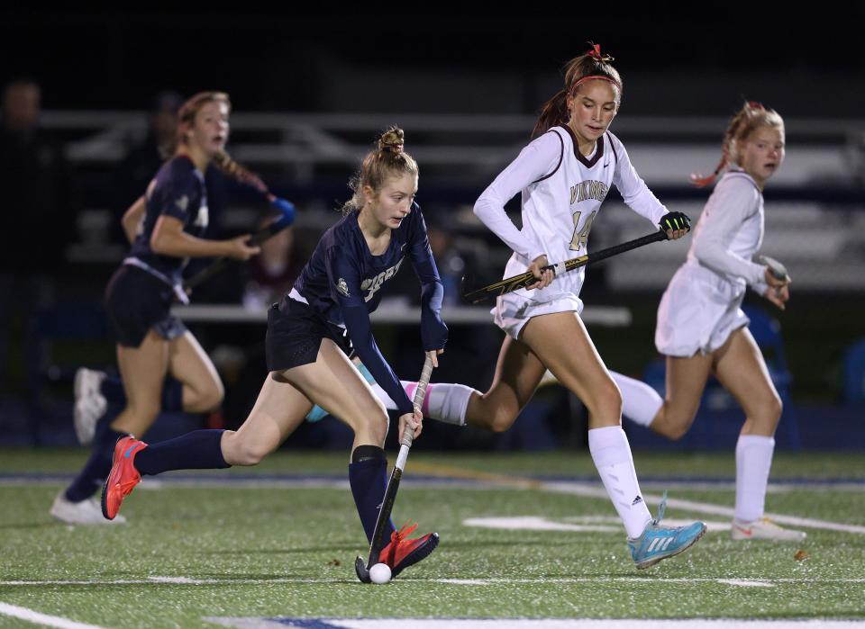 Sutherland's Ava Bleier carries the ball against Mendon's Ella Peyre.