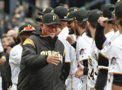 FILE - In this April 2, 2018, file photo, Pittsburgh Pirates' Clint Hurdle, left, greets players as he ins introduced before the Pirates' home opener baseball game against the Minnesota Twins in Pittsburgh. (AP Photo/Gene J. Puskar, File)