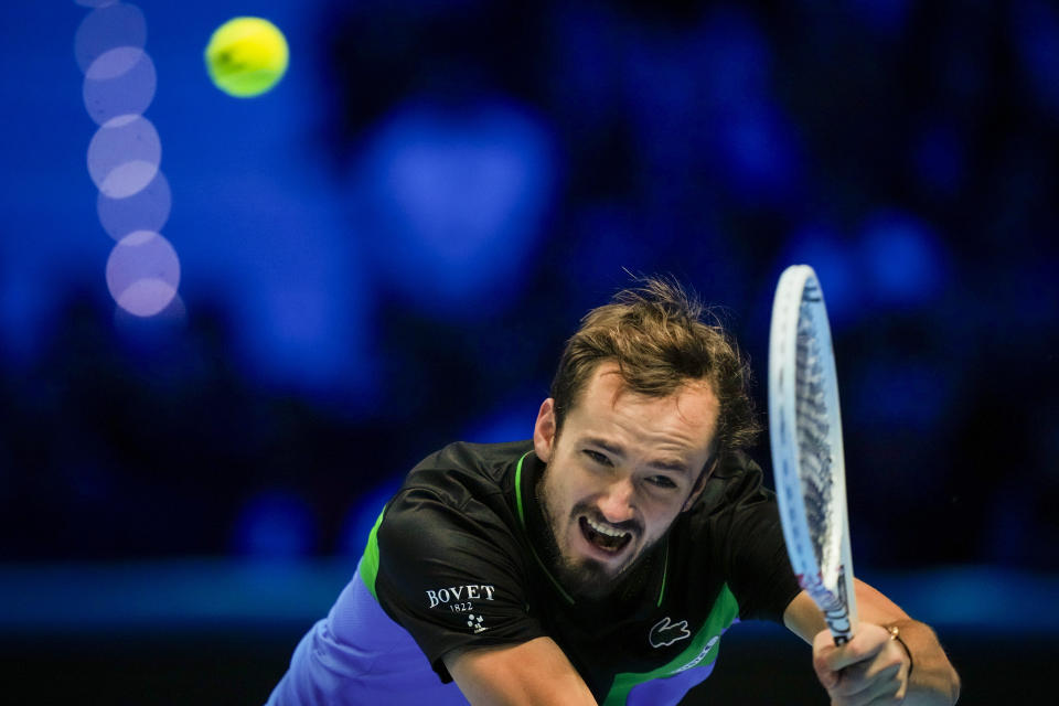 Russia's Daniil Medvedev returns the ball to Italy's Jannik Sinner during their singles semifinal tennis match of the ATP World Tour Finals at the Pala Alpitour, in Turin, Italy, Saturday, Nov. 18, 2023. (AP Photo/Antonio Calanni)