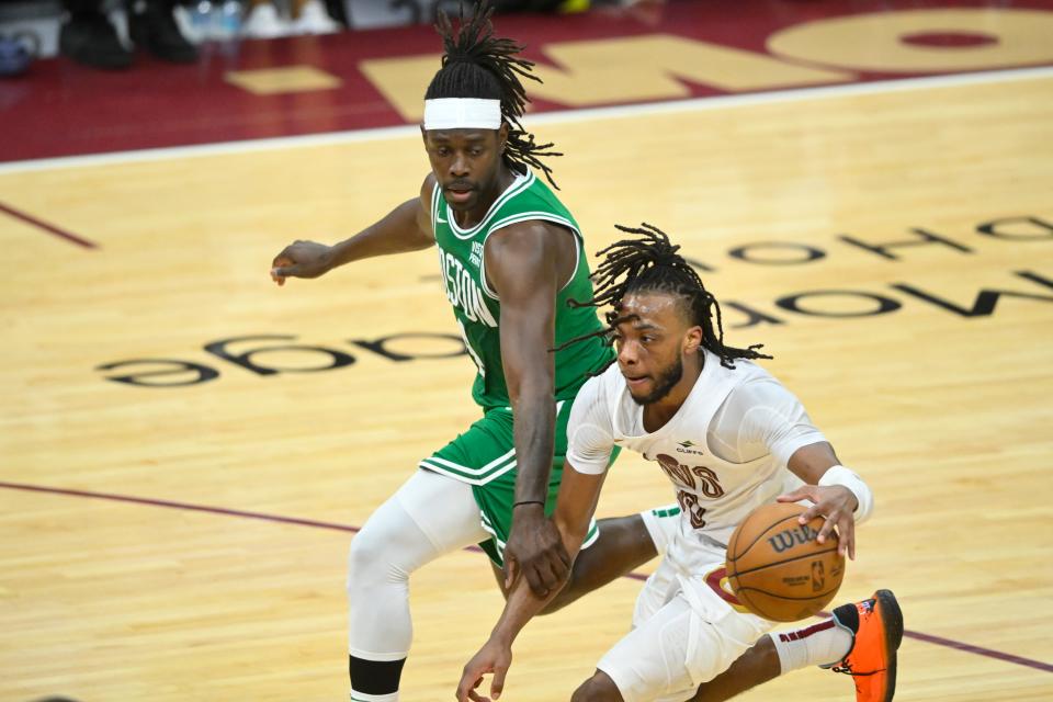 Cavaliers guard Darius Garland dribbles against Celtics guard Jrue Holiday in the fourth quarter of Game 4 of the Eastern Conference semifinals, May 13, 2024, in Cleveland.