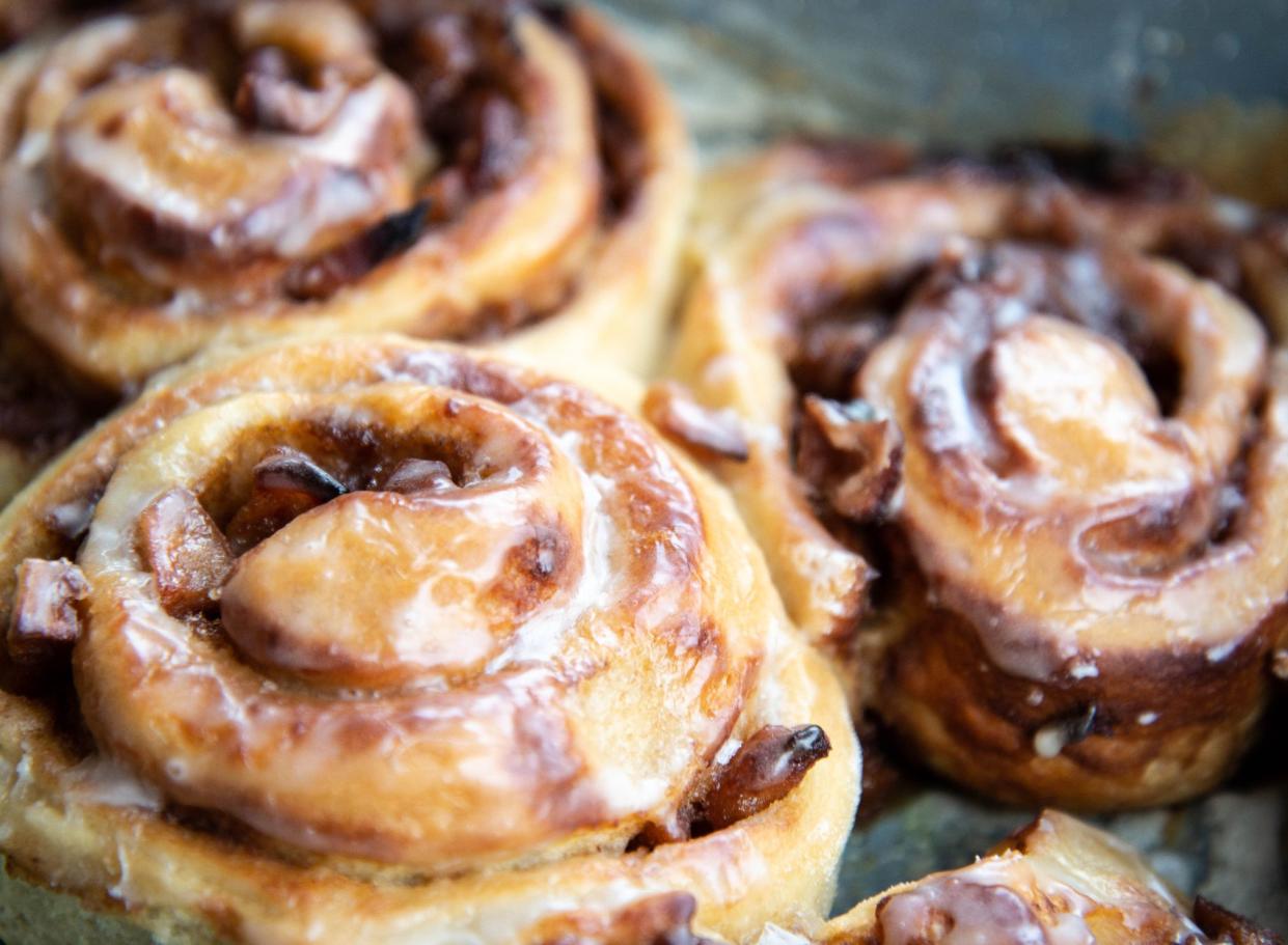 3 cinnamon buns with icing