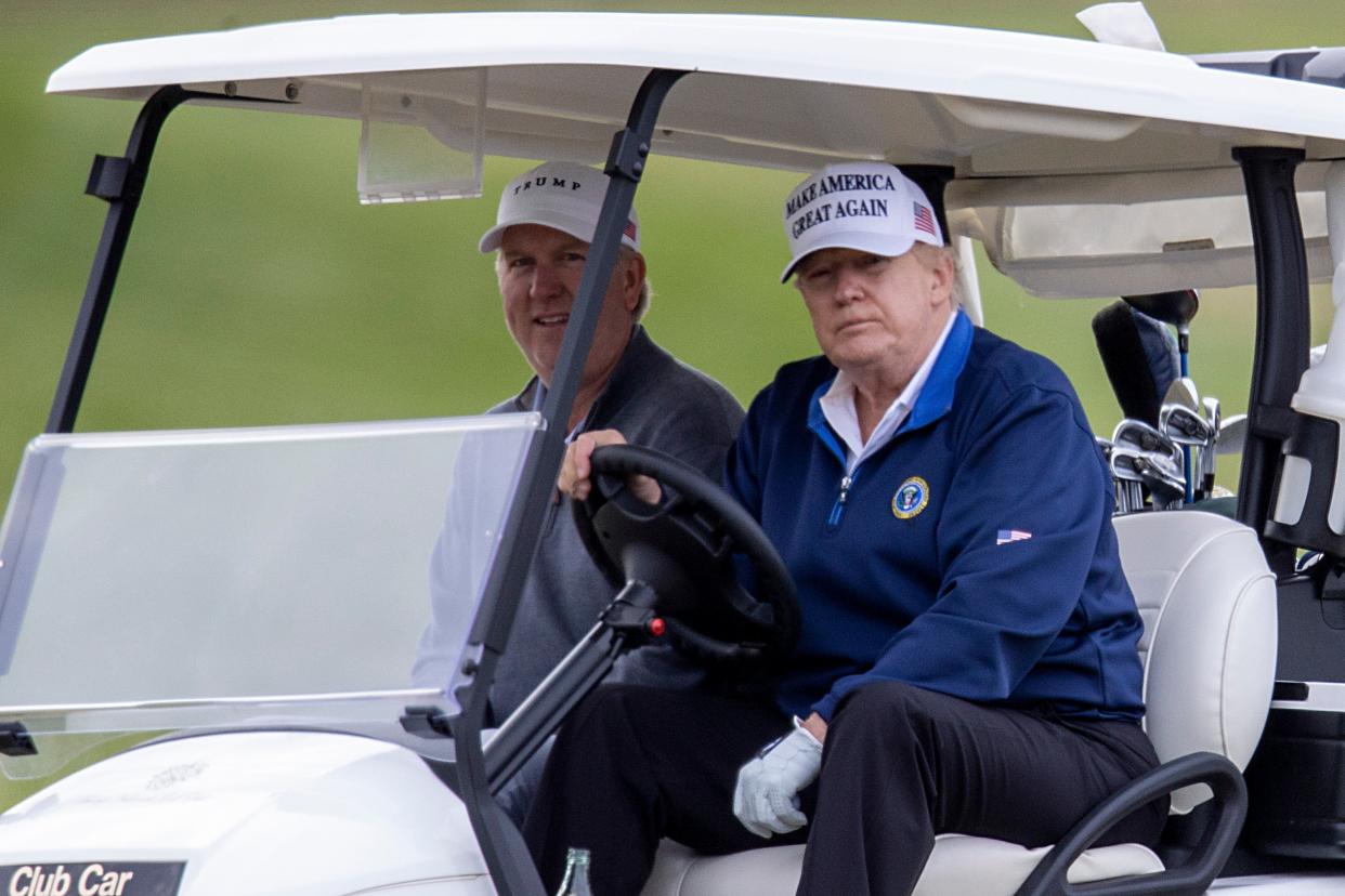 <p>Donald Trump golfs at Trump National Golf Club on 22 November in Sterling, Virginia.</p> (Getty Images)