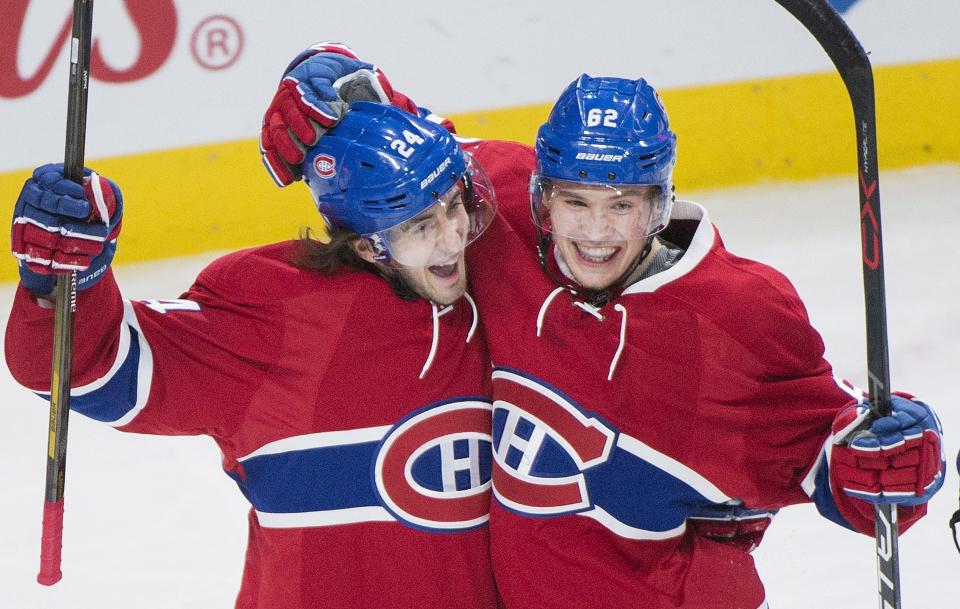 Montreal Canadiens' Artturi Lehkonen, right, celebrates with teammate Phillip Danault after scoring against Colorado Avalanche during first period NHL hockey action in Montreal, Saturday, Dec. 10, 2016. (Graham Hughes/The Canadian Press via AP)