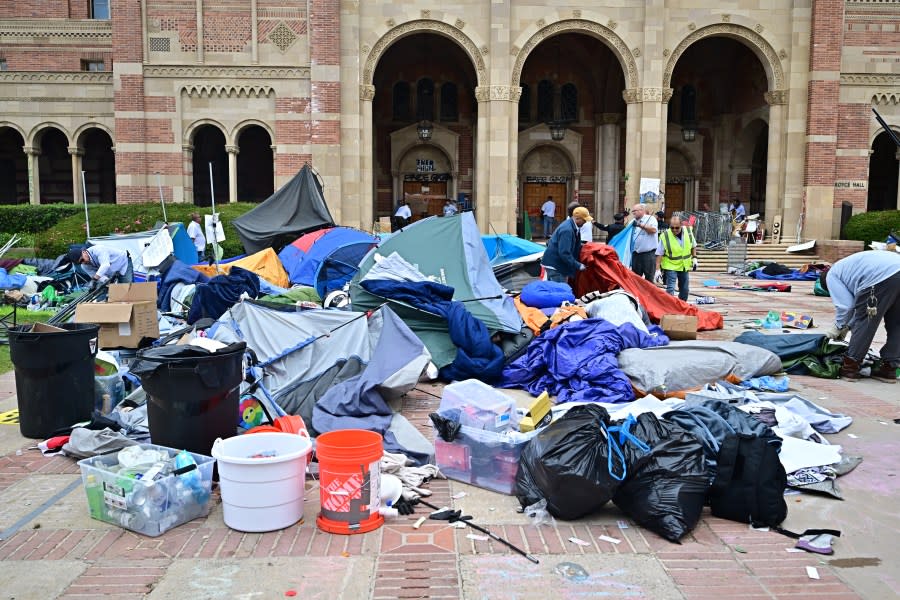 Workers clean up the University of California, Los Angeles (UCLA) campus after police evicted pro-Palestinian students, in Los Angeles, California, early on May 2, 2024. Hundreds of police tore down protest barricades and began arresting students early Thursday at the University of California, Los Angeles – the latest flashpoint in an eruption of protest on US campuses over Israel’s war against Hamas in Gaza. (Photo by Frederic J. Brown / AFP) (Photo by FREDERIC J. BROWN/AFP via Getty Images)