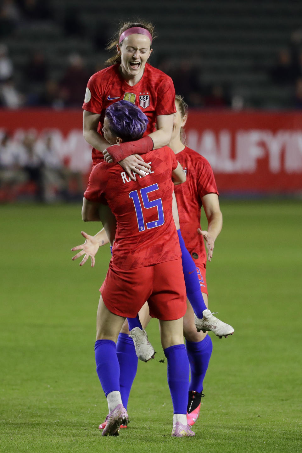 U.S. midfielder Rose Lavelle, top, celebrates with forward Megan Rapinoe after scoring against Mexico during the first half of a CONCACAF women's Olympic qualifying soccer match Friday, Feb. 7, 2020, in Carson, Calif. (AP Photo/Chris Carlson)