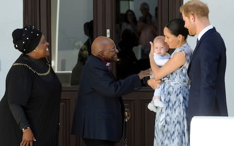 Prince Harry and Meghan, Duchess of Sussex, holding their son Archie, meet Anglican Archbishop Emeritus, Desmond Tutu and his wife Leah in Cape Town, South Afric - Credit: AP&nbsp;/Henk Kruger