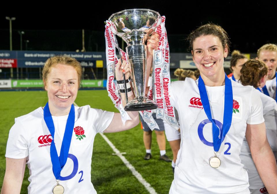 <p>England’s La Toya Mason (left) and captain Sarah Hunter hold the Six Nations trophy after winning their Women’s 6 Nations match against Ireland to complete the Grand Slam at Donnybrook Stadium, Dublin. </p>