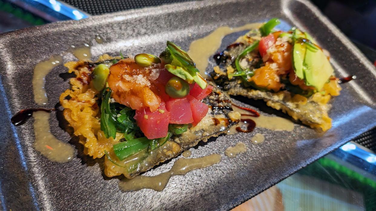 Sushi tacos that include seaweed, edamame, tuna, avocado. The seaweed is battered and fried for a crunchy base layer at Nama Sushi in Central Market.