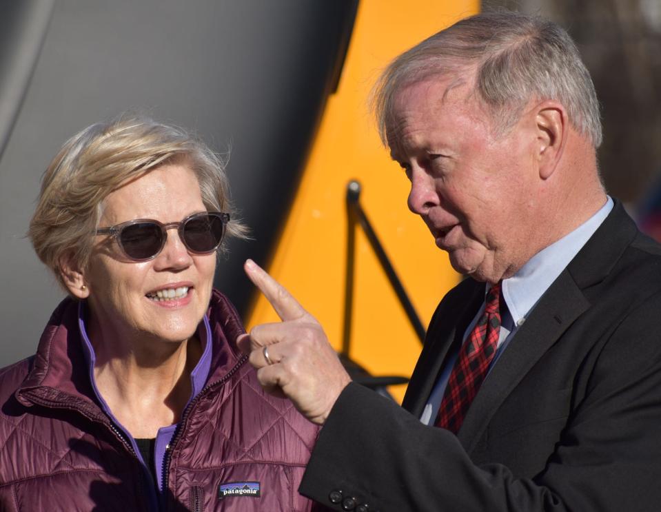 In this December 2022 file photo, Senator Elizabeth Warren is seen with Fall River Mayor Paul Coogan at Durfee High School to celebrate the first round of electric bus funding won for Fall River Public Schools.