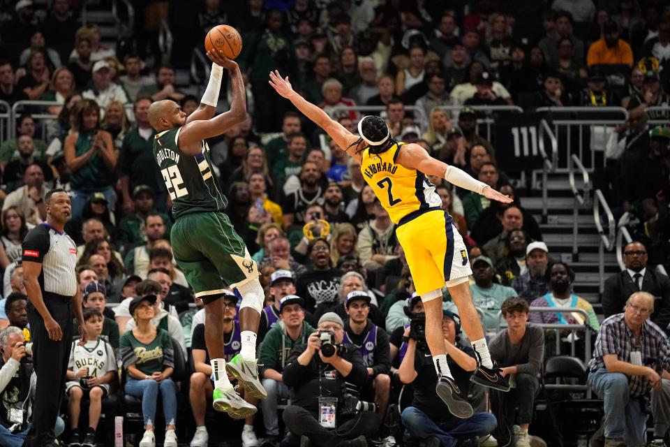 The Milwaukee Bucks' Khris Middleton (22) shoots against the Indiana Pacers during Game 5 at Fiserv Forum.