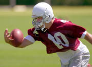 Arizona Cardinals safety Pat Tillman pulls in an interception with one hand during mini camp in Tempe, Ariz. (AP Photo/Paul Connors)