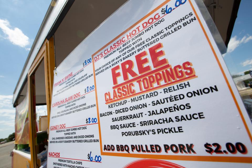 The menu for DJ's Catering food truck includes a selection of specialty hotdogs, nachos and chili.