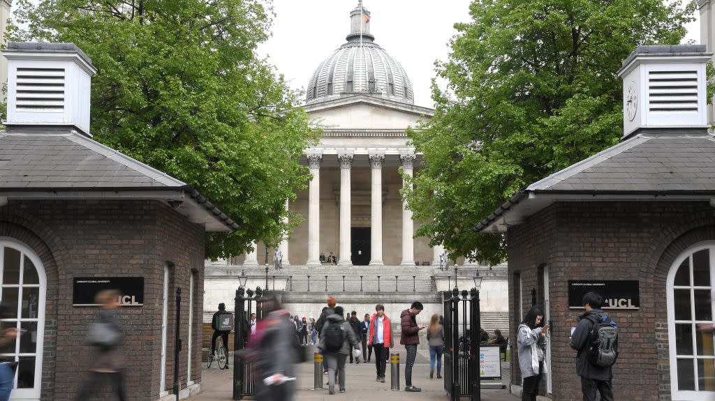 Students and visitors are seen walking around the main campus buildings of University College London (UCL) in London, Britain