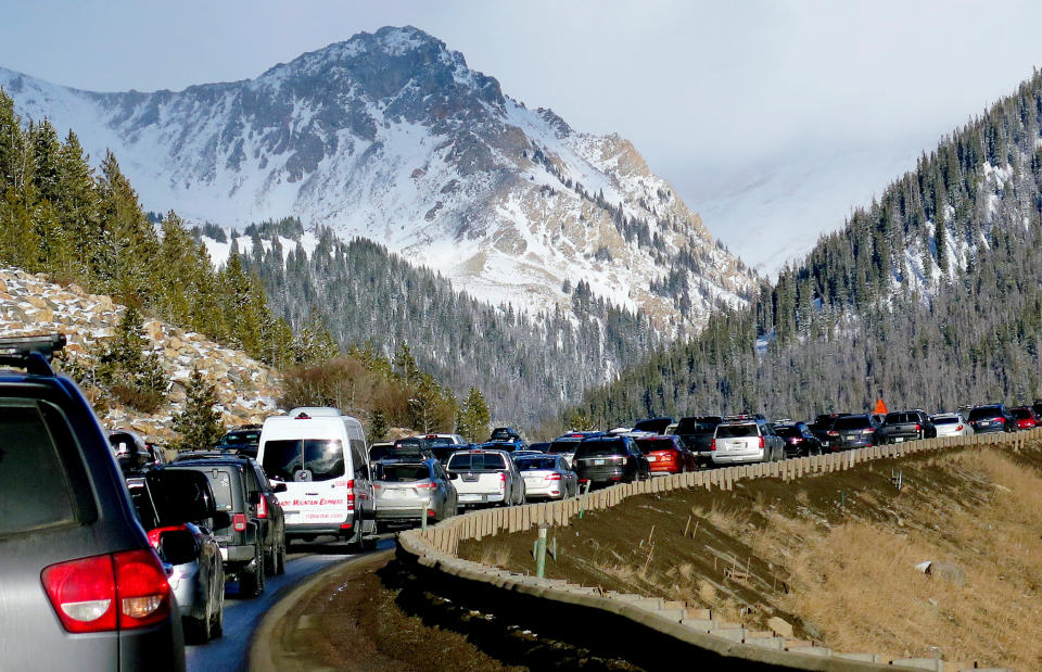 FILE - In this Jan. 7, 2018, file photo, traffic backs up on Interstate 70 near Silverthorne, Colo., a familiar scene on the main highway connecting Denver to the mountains. Heavy ski traffic along the interstate has been common for years, but Colorado's recent population boom is making it increasingly challenging for transportation officials who deal with a bare-bones budget. (AP Photo/Thomas Peipert, File)