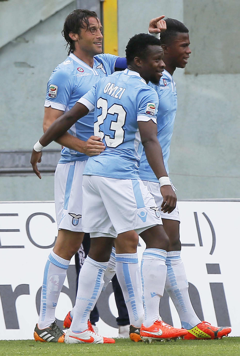 Lazio's Stefano Mauri, left, celebrates with teammates including Ogenyi Onazi, center, after scoring during a Serie A soccer match between Livorno and Lazio, in Leghorn, Italy, Sunday, April 27, 2014. (AP Photo/Francesco Speranza )