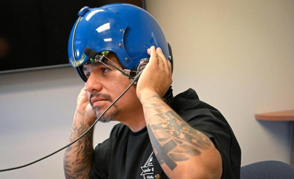 Erik Erazo tried on a flight helmet as he prepared for his flight with the U.S. Navy Blue Angels. Tammy Ljungblad/tljungblad@kcstar.com