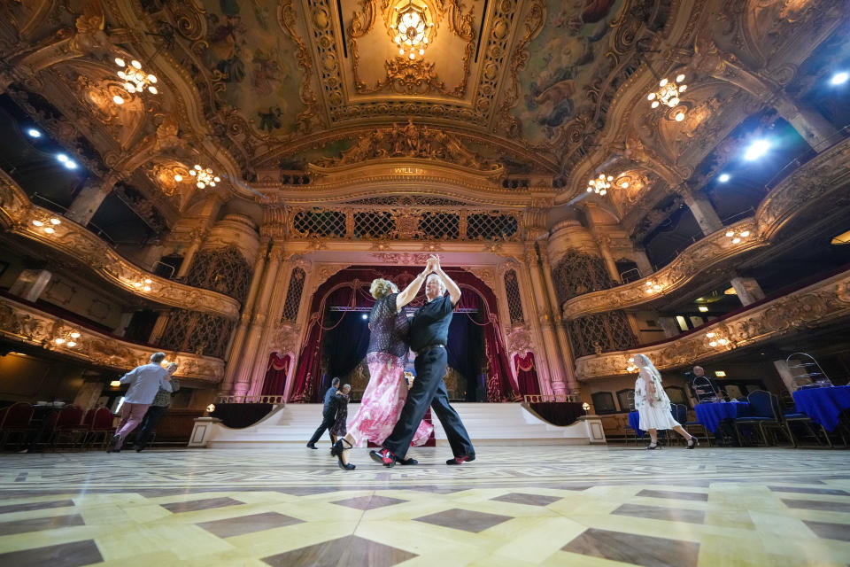 Dancers take to the restored Blackpool Tower Ballroom dance floor after major restoration work on the famous sprung wooden floor on January 25, 2022 in Blackpool, England.  Today is the annual re-opening of the dance season at the ballroom and the first time dancers have used the restored floor. Over one hundred layers of lacquer were removed by specialists to reveal the beauty of 30,602 individual blocks of oak, mahogany and walnut which were then re-laquered and sealed. (Photo by Christopher Furlong/Getty Images)