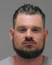 In a photo provided by the Kent County Sheriff, Adam Dean Fox is shown in a booking photo. Fox is one of several people charged with plotting to kidnap Michigan Democratic Gov. Gretchen Whitmer, authorities said Thursday, Oct. 8, 2020, in announcing charges in an alleged scheme that involved months of planning and even rehearsals to snatch Whitmer from her vacation home. (Kent County Sheriff via AP)